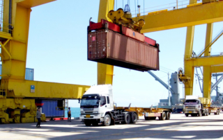 Containers being loaded at shipping port